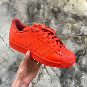 Custom Adidas Superstars in vibrant orange 🍊